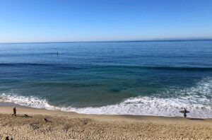 Dog Walker and Surfer at St. Ann's Beach