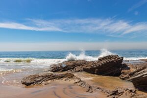 Waves crashing rock