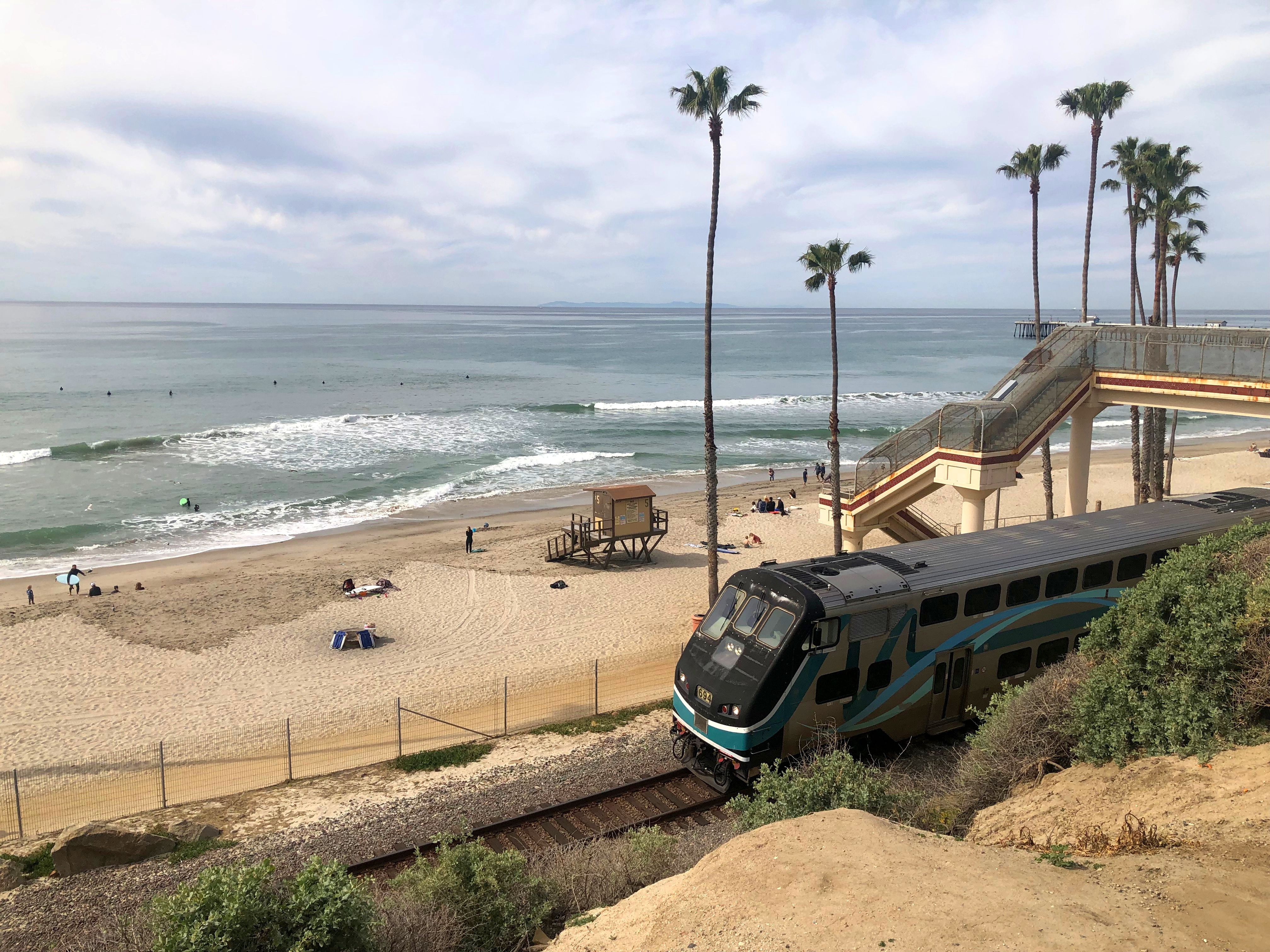 Train running by T-street down the Pacific Coast