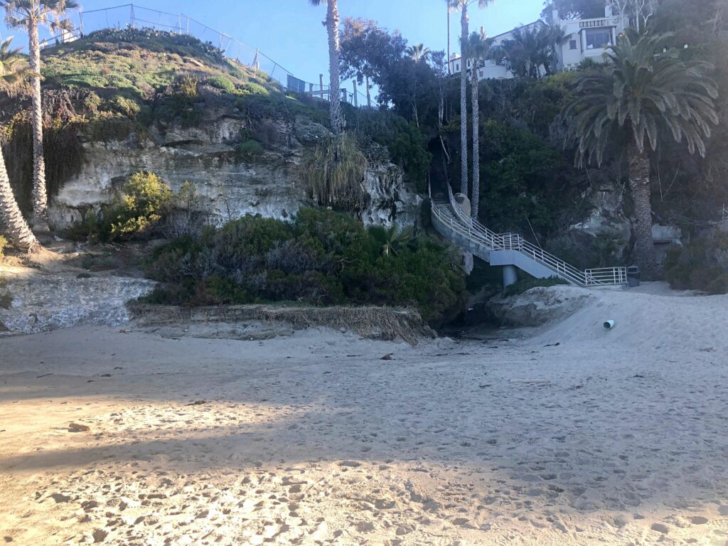 west street beach cliffs