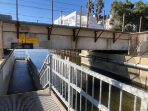 Walkway under rail tracks