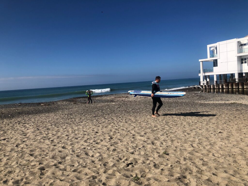 Surfer leaving Poche Beach