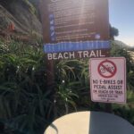 No electric bikes sign on beach trail