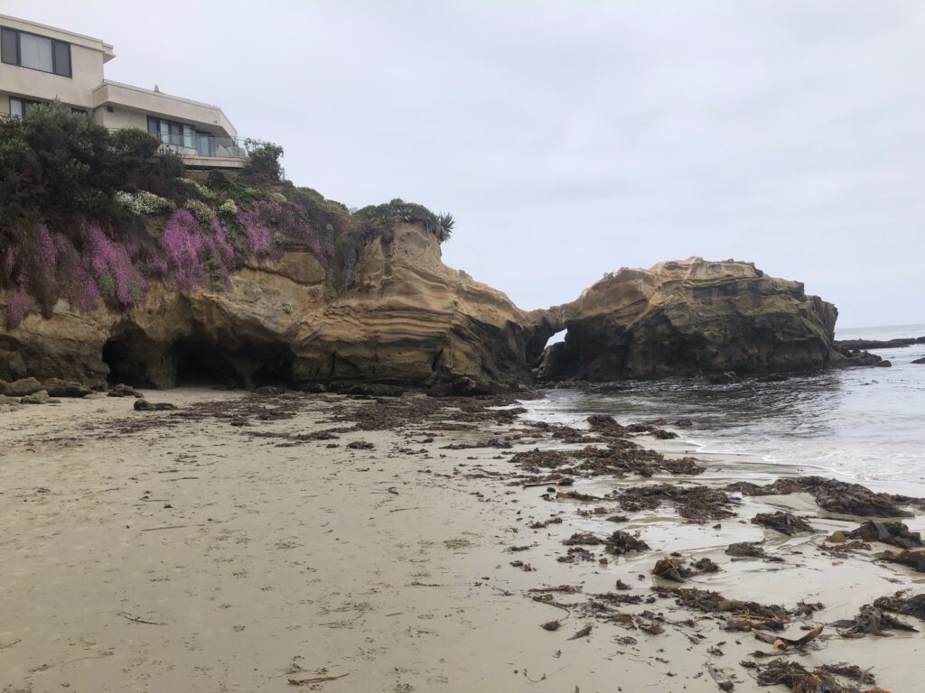 Pearl Street south rock outcrop with Arch passageway to Woods Cove